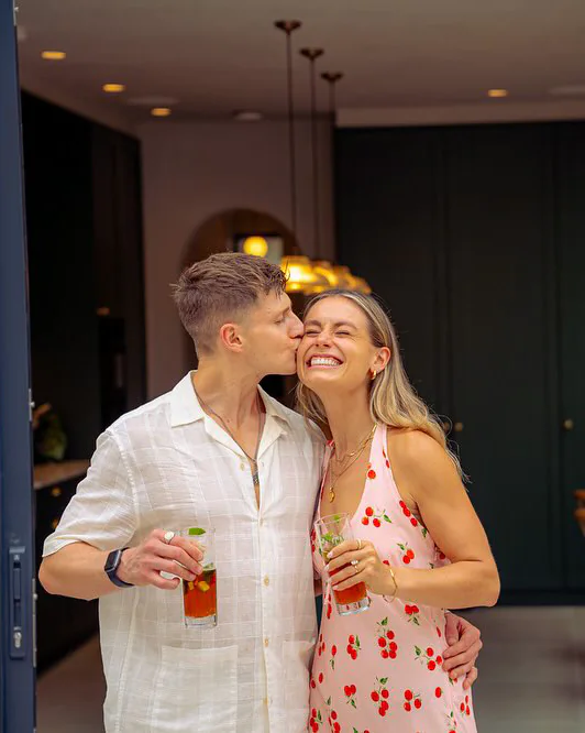Rhiannon and Tom at home, a drink each